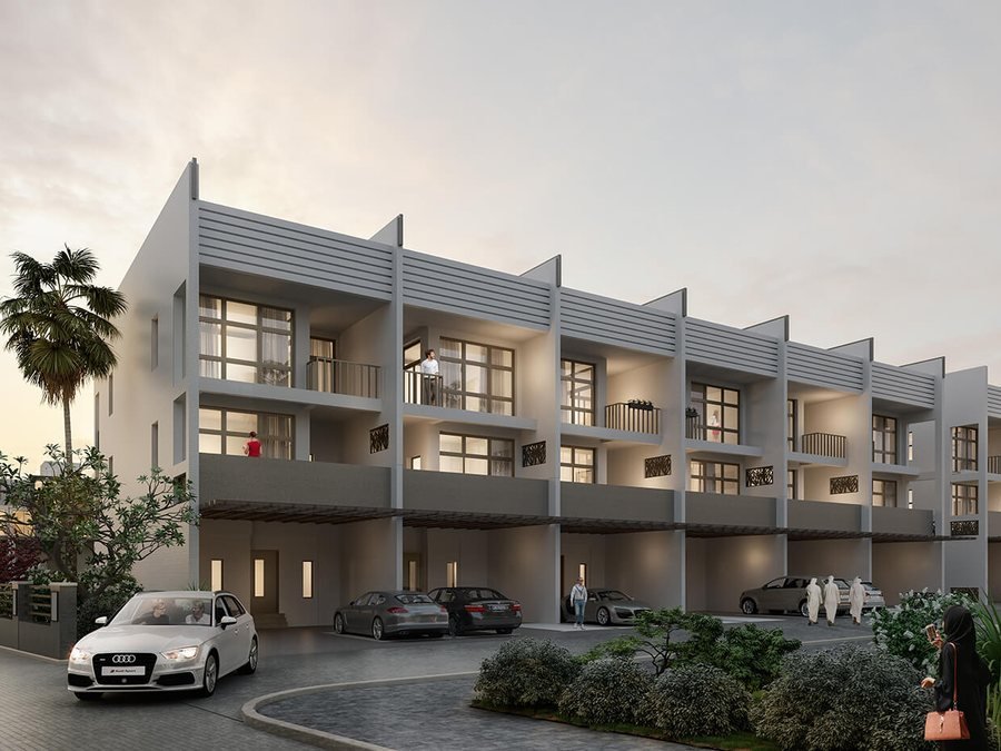 Townhouses at Ellington Villas Dubai — a row of three-storey townhouses at dusk with recessed balconies, louvred screening and covered parking
