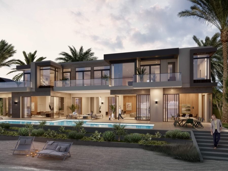 Villa at Ellington Villas Dubai — a two-storey villa at dusk with full-height glazing, a wraparound terrace, private pool and mature palms